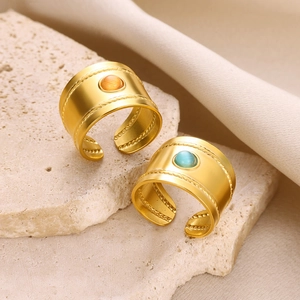 Adjustable gold plated stainless steel ring set with sunburst star and round gemstones