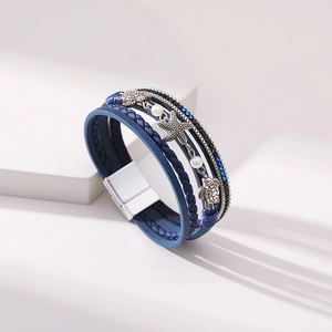 Detailed macro view of the blue leather ocean bracelet with a magnetic clasp