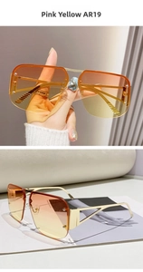 Detail of pink-yellow gradient lenses on gold metal pilot sunglasses with semi-rimless frame