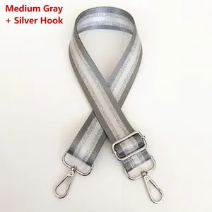 Close-up of adjustable 3.8cm grey nylon bag strap with silver glitter stripes and hooks