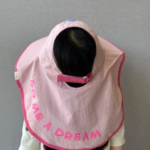 Pink kids sun hat with wide neck flap featuring DO ME A DREAM text for sun protection
