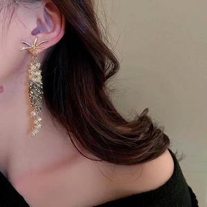 Elegant gold bow earrings with crystal tassels and gradient bead dangles for women