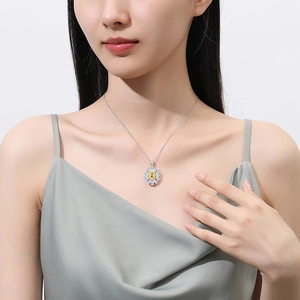 Sparkling S925 sterling silver necklace with square yellow gemstone and diamond halo on model