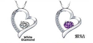 Close-up of S925 sterling silver heart necklaces with white and purple cubic zirconia
