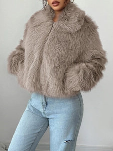 Detailed view of the faux fur jacket with full zipper and stylish cropped cut in taupe