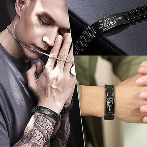 Detailed view of black stainless steel custom engraved men bracelet with names and baby feet