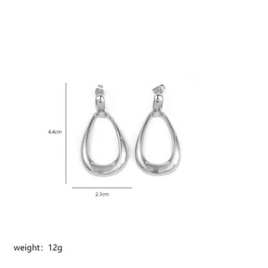 Detailed view of silver irregular teardrop earrings with dimensions 4.4cm by 2.3cm