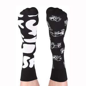 Detailed view of asymmetric cotton socks featuring abstract rabbit and duck patterns