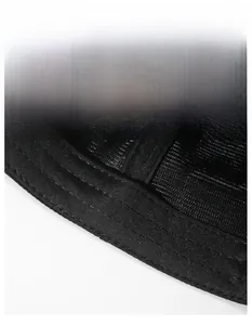 Detail of wide moisture-wicking sweatband inside a black baseball cap with neat stitching