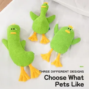 Three plush squeaky green duck dog toys with textured waffle fabric and yellow crowns