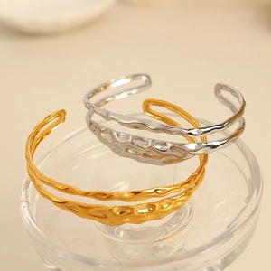 Gold and silver layered titanium steel open bangle with hammered texture finish