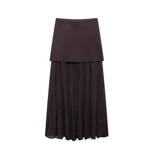 Detail view of dark brown double-layer maxi skirt featuring elegant pleated texture and fabric