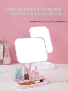 Close-up of swivel makeup mirror with jewelry hooks and partitioned storage base