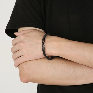 Detail shot of black stainless steel cable bracelet with smooth infinity symbol clasp