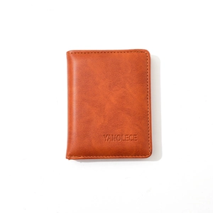 Close-up of brown PU leather men's wallet showing natural grain texture and embossed logo