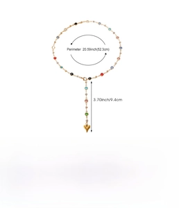 Detail view of colorful bead necklace with gold heart pendant and size specifications