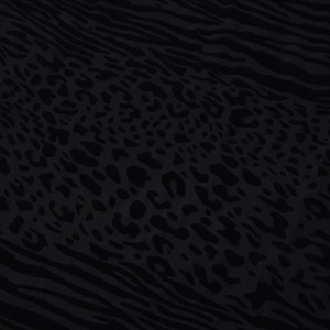 Détail du tissu floqué noir avec motifs animaliers de léopard et de zèbre