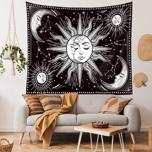 Detailed close-up of Bohemian sun and moon tapestry with celestial pattern texture