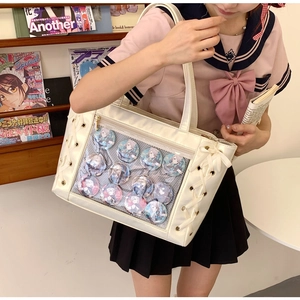 White anime ita bag featuring a large clear PVC window and decorative side lacing