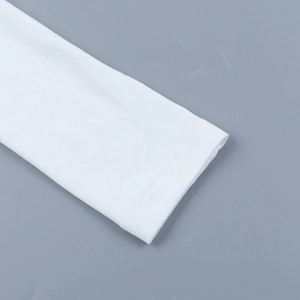 Detailed close-up of white ribbed knit sleeve cuffs showing neat stitched hem seams
