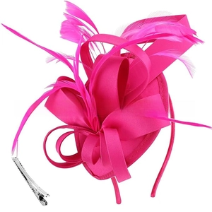 Detailed view of magenta satin pillbox hat with feathers and dual clip headband attachment