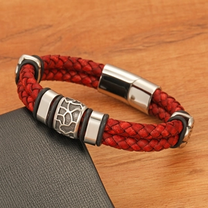 Detail of red braided leather men's bracelet with silver rings and magnetic clasp