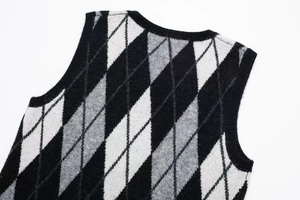 Detail view of V-neck neckline and diamond knit texture on this women casual dress