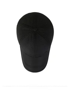 Close-up of black baseball cap featuring V-shaped wave quilted texture and metal detail