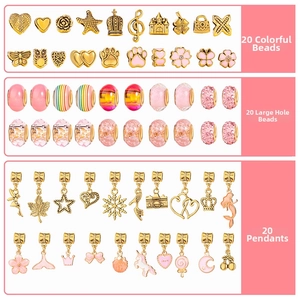 Macro view of 60pcs pink and gold DIY charm bead set including unicorns and resin beads