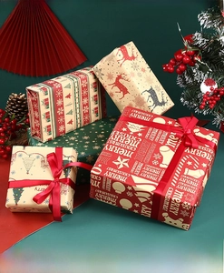 Close-up of assorted Christmas kraft wrapping papers with reindeer and tree patterns