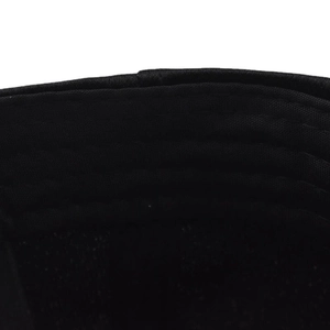 Close-up of durable reinforced multi-row stitching on a black fabric baseball cap brim