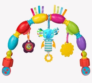 Detail of baby stroller arch toy featuring a plush elephant, teething rings and colorful animals