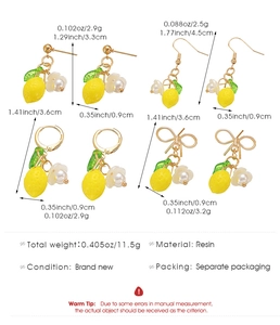 Detail view of yellow lemon earrings with dimensions and weight specs in inches and cm