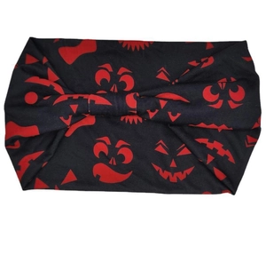 Halloween wide headband featuring red pumpkin and bat prints on black moisture-wicking fabric