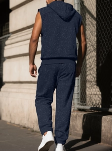 Rear view of a navy sleeveless hoodie and joggers set with unique mottled fabric texture