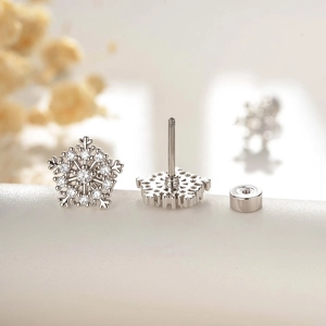 Elegant snowflake stud earrings in silver finish with sparkling zircons and screw backs