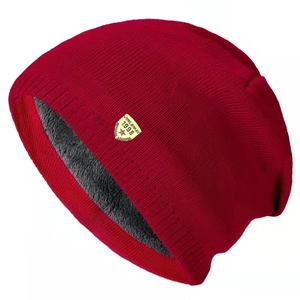 Men's deep red knitted beanie with thick grey fleece lining and retro logo patch
