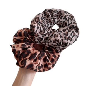Two-pack of retro leopard print satin scrunchies with elegant glossy silk texture