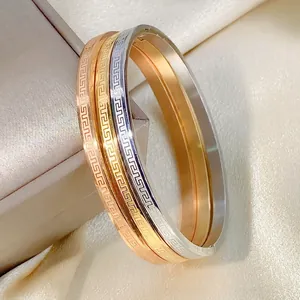 Classic stainless steel meander pattern bangle set in gold, rose gold and silver