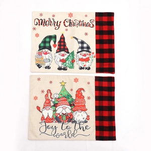 Linen Christmas table mats featuring gnome and tree patterns with red plaid borders