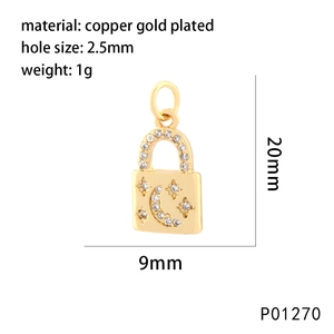 Detailed view of heart lock pendant in gold plated copper with star and moon zircon inlay