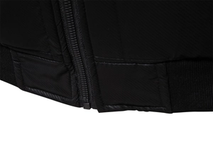 Detail of the high-quality zipper and ribbed hem texture on the black winter jacket