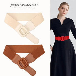 Detail view of versatile elastic fashion belts in beige and brown with rectangular buckles