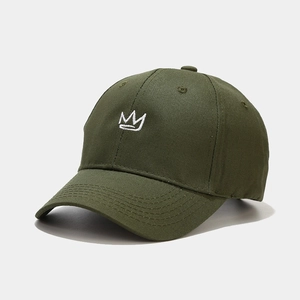 Close-up of crown embroidery on a retro army green cotton baseball cap for outdoor wear