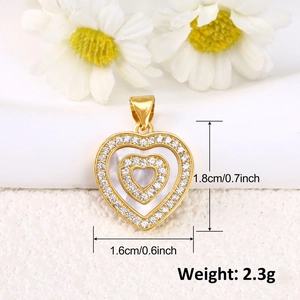 Detail view of heart pendant with shell inlay and gold finish showing precise dimensions
