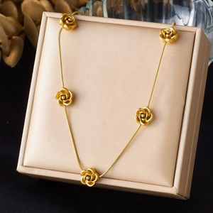 Gold rose necklace with five floral charms on a sleek snake chain in a gift box