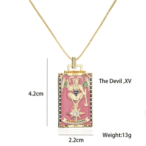 Detail view of 18K gold plated tarot devil pendant with colorful zircon stones