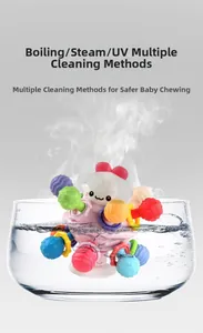 Detail of baby teething ball in boiling water showing high-temperature resistance