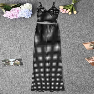 Flat lay of polka dot crop top and high waist maxi skirt set on a felt background