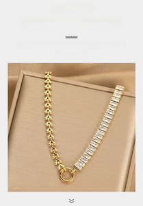 Detail of gold plated titanium necklace featuring rectangle zircon and bead chain links